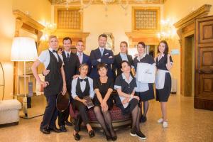 a group of people posing for a picture on a couch at Arcadia Boutique Hotel in Venice