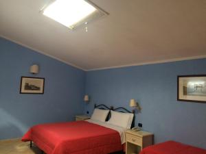 Postel nebo postele na pokoji v ubytování Hotel Relais Modica