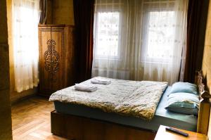 A bed or beds in a room at Emre's Stone House