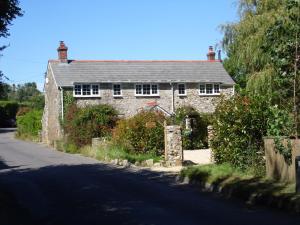 a stone house on the side of a road at Newchurch Nook in Newchurch