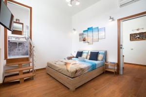A bed or beds in a room at La Terrazza 38