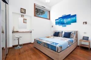 A bed or beds in a room at La Terrazza 38