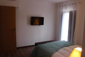 Uma cama ou camas num quarto em Meimoa Guesthouse