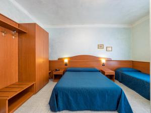 Łóżko lub łóżka w pokoju w obiekcie Hotel Aurora