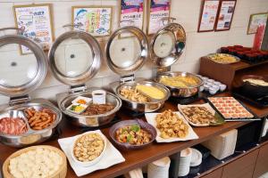 a buffet with many different types of food in bowls at Canal City Fukuoka Washington Hotel in Fukuoka