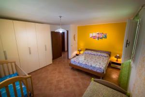 A bed or beds in a room at Villa Laura Salento