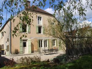 a house with a picnic table in front of it at Elegant Family Home in Bouix in Bouix