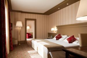 Letto o letti in una camera di Hotel De La Paix