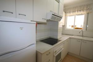 A kitchen or kitchenette at Villa Adriana 209