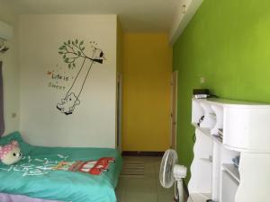 Postel nebo postele na pokoji v ubytování 隨緣居
