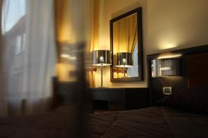 Postel nebo postele na pokoji v ubytování Menorah Hotel