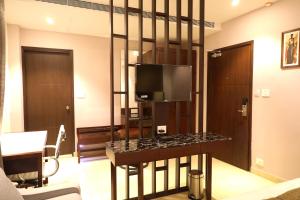 TV a/nebo společenská místnost v ubytování Visthara inn - Comfort Stay