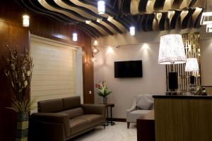 TV a/nebo společenská místnost v ubytování Visthara inn - Comfort Stay