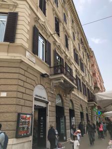 a group of people standing outside of a building at 207 Inn in Rome