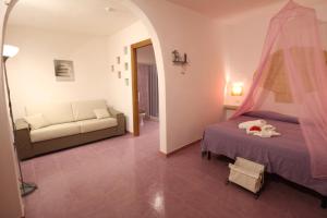 Cama ou camas em um quarto em L'Oasi Villaggio Albergo