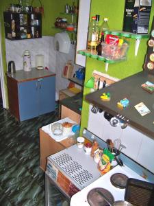 a small kitchen with a laptop on a counter at Yo Ho Hostel in Varna City