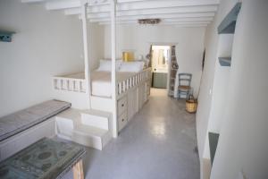Postel nebo postele na pokoji v ubytování Pyrgos Stone House