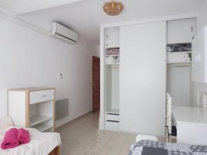 Łóżko lub łóżka w pokoju w obiekcie Clubrent - Townhouse La Merced