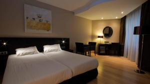 Postel nebo postele na pokoji v ubytování De Keyser Hotel