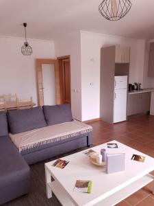 a living room with a couch and a table at Fisherman's House in Aljezur