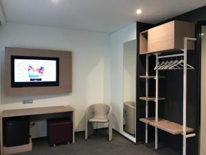 TV a/nebo společenská místnost v ubytování Hotel Carnia