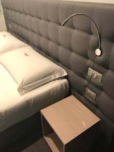 Posteľ alebo postele v izbe v ubytovaní Hotel Carnia