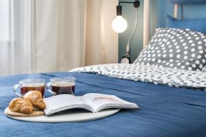 Posteľ alebo postele v izbe v ubytovaní Elite Apartments City Center Suites