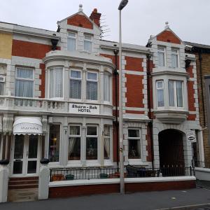 a building on the corner of a street at Sharn Bek Hotel in Blackpool