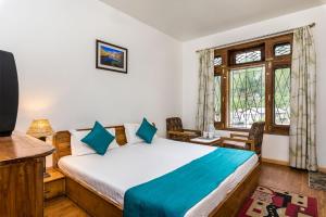 Hotel Kullu Valley客房内的一张或多张床位