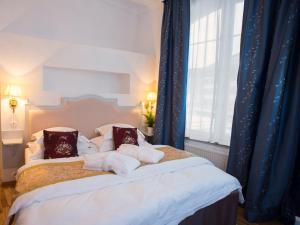 Postel nebo postele na pokoji v ubytování Brommavik Hotel