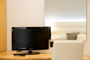 a computer monitor sitting on top of a desk at Hotel La Conchiglia in Bellaria-Igea Marina