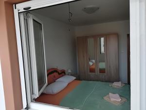 Una cama o camas en una habitación de Apartments Vukovic