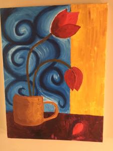 a painting of a red flower in a vase at Homestay Norwich in Norwich