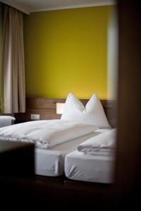 Postel nebo postele na pokoji v ubytování Basic Hotel Innsbruck