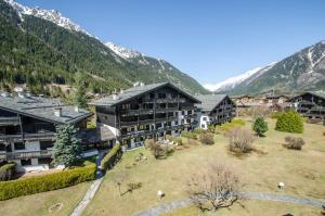 an aerial view of a resort with mountains in the background at Petra in Chamonix