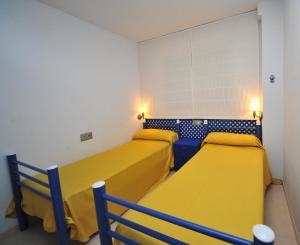 Un ou plusieurs lits dans un hébergement de l'établissement Las Vegas vista mar Orangecosta