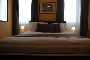 Posteľ alebo postele v izbe v ubytovaní Joy Guesthouse