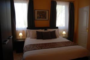 Posteľ alebo postele v izbe v ubytovaní Joy Guesthouse