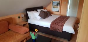 Posteľ alebo postele v izbe v ubytovaní Joy Guesthouse