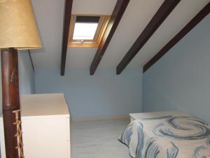 A bed or beds in a room at Apartamentos El Majuelo