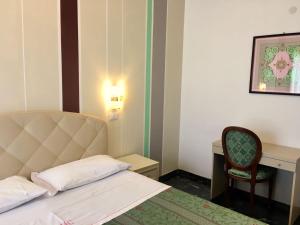 Postel nebo postele na pokoji v ubytování Park Hotel Castello