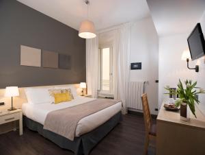 A bed or beds in a room at 111 ColaDiRienzo Rooms - by AD Roma