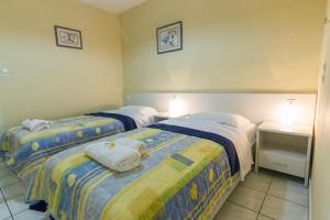 Postel nebo postele na pokoji v ubytování Stathopoulos Apartments