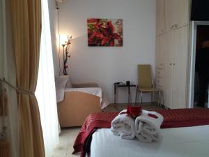 Postel nebo postele na pokoji v ubytování Rodon Apartments