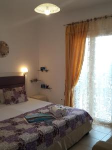 Postel nebo postele na pokoji v ubytování Rodon Apartments