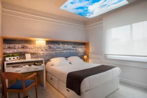 Posteľ alebo postele v izbe v ubytovaní Hotel Ribes Roges