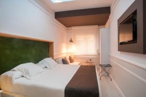 Posteľ alebo postele v izbe v ubytovaní Hotel Ribes Roges