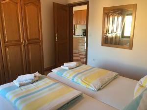 Postel nebo postele na pokoji v ubytování Apartmani Amado/Lozic