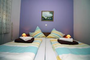 Postel nebo postele na pokoji v ubytování Apartmani Amado/Lozic