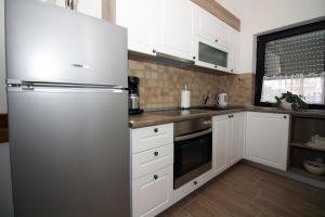 Kuchyň nebo kuchyňský kout v ubytování Apartmani Amado/Lozic